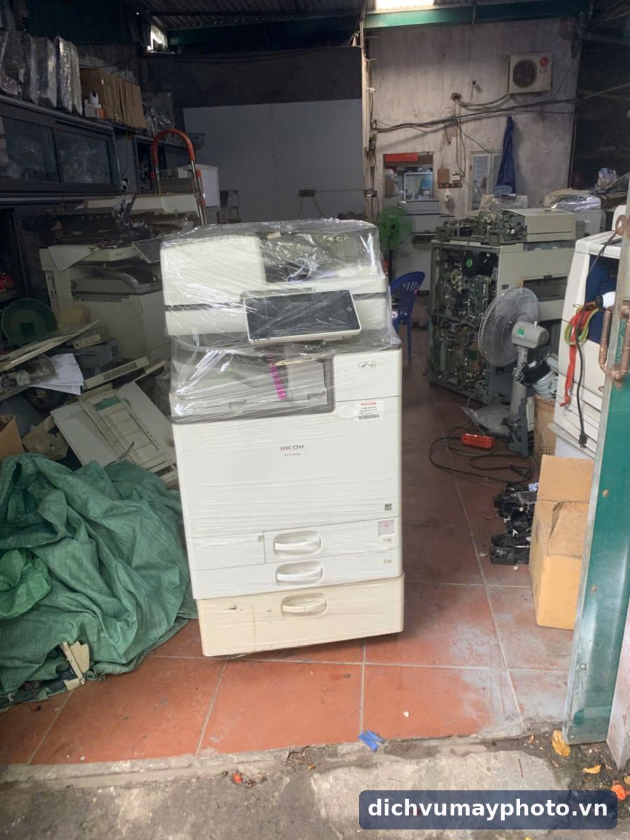 Máy photocopy màu Ricoh cũ đã kiểm tra, đóng màng chờ giao tại kho Thần Vũ